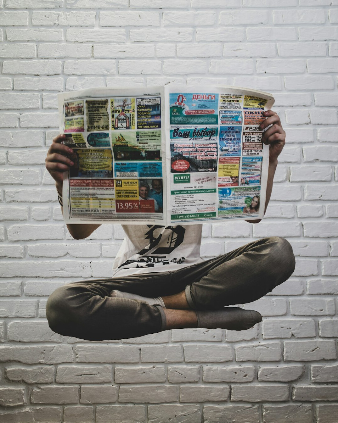 person reading newspaper